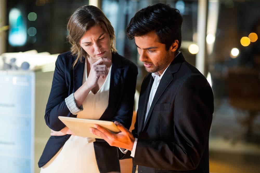 colleagues checking results on a tablet