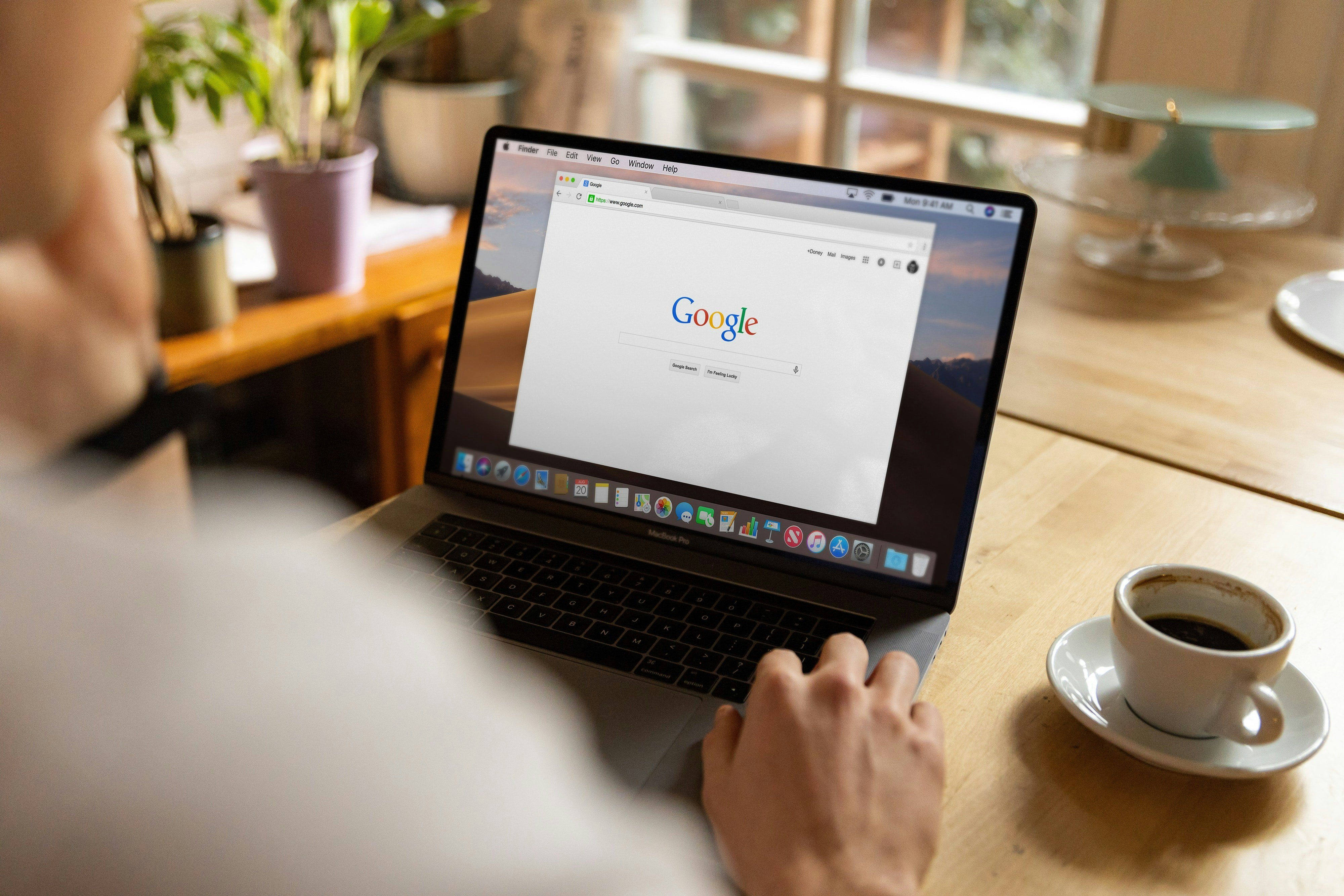 guy searching Google at his laptop