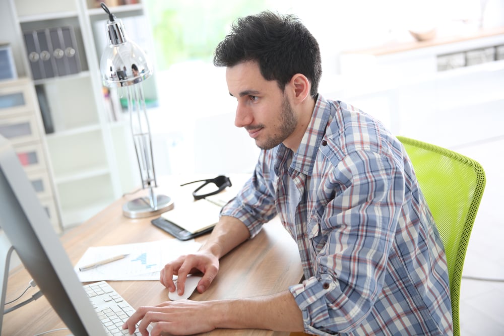 copywriter writing a blog at this computer